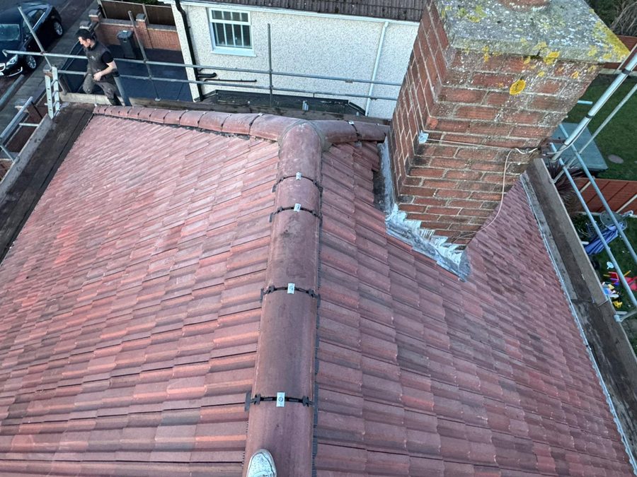Clean hip detail with new tiles and lead flashing