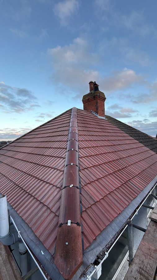 New tiles and lead flashing around the chimney